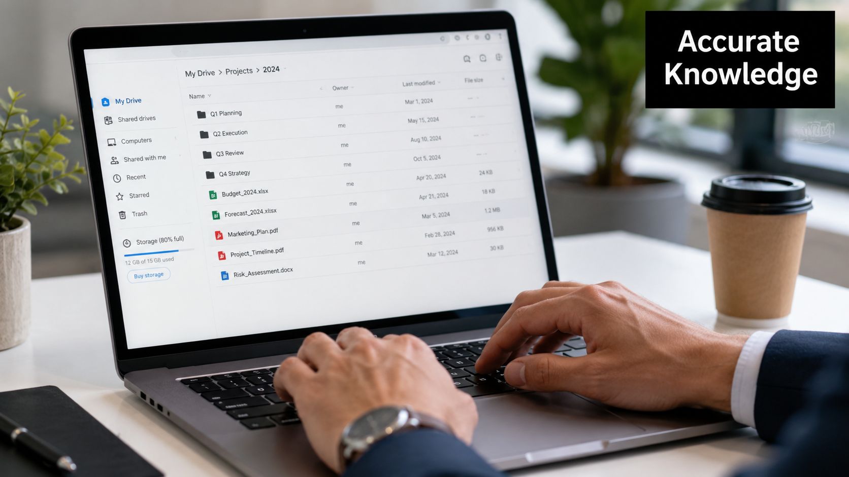 A professional working on a laptop, viewing a Google Drive project folder on their screen.