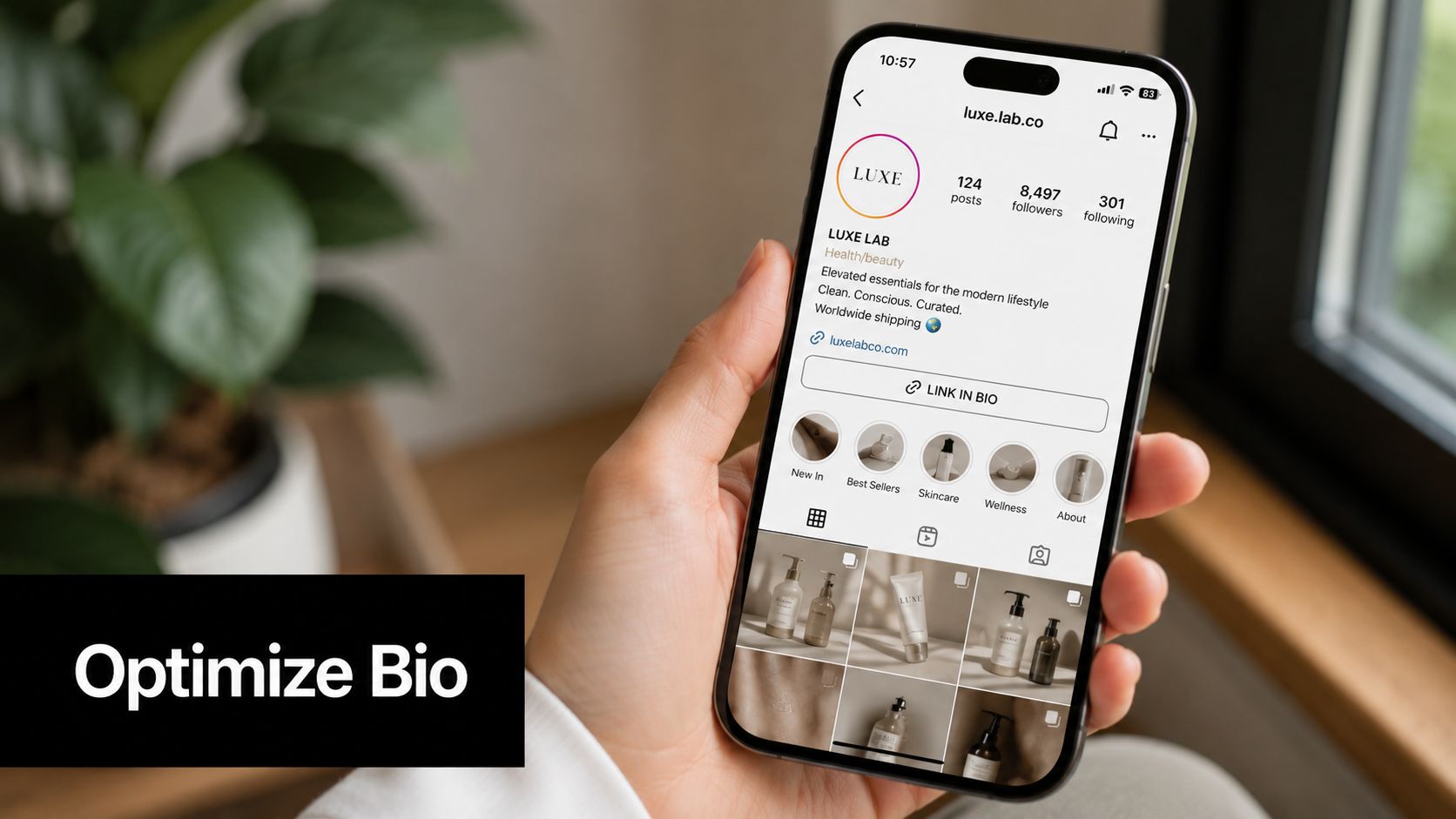 A person holding an iPhone displaying a professional lifestyle brand's Instagram profile page with product photos.